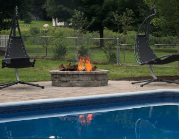 Fire Pit sitting beside the pool